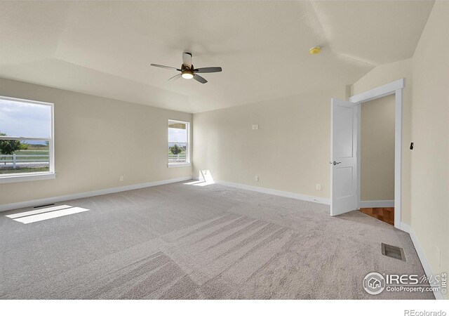 3643 Crested Owl Ct, Dacono, CO 80514 - carpeted spare room featuring ceiling fan and a tray ceiling