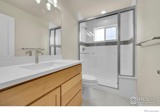 3643 Crested Owl Ct, Dacono, CO 80514 - full bath with a stall shower, vanity, and marble finish flooring