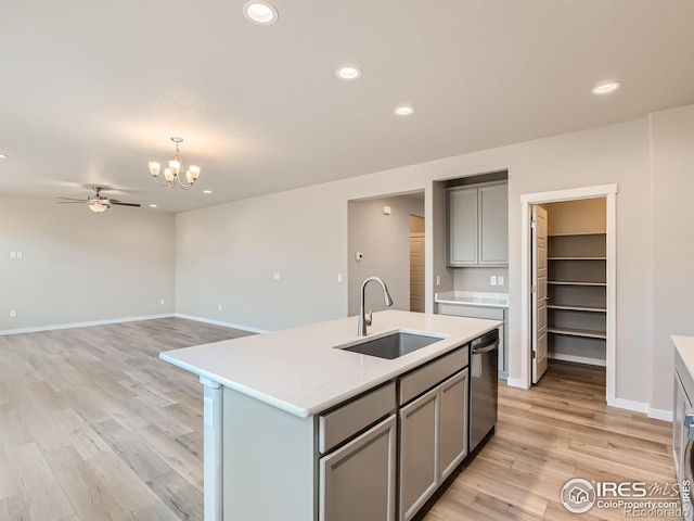 13 Chipeta Way, Lochbuie, CO 80603 - kitchen featuring gray cabinetry, dishwasher, light countertops, recessed lighting, and light wood finished floors
