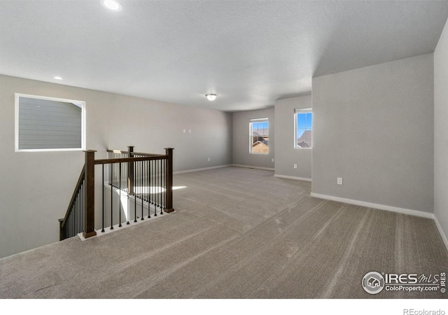 13 Chipeta Way, Lochbuie, CO 80603 - carpeted spare room featuring baseboards and recessed lighting