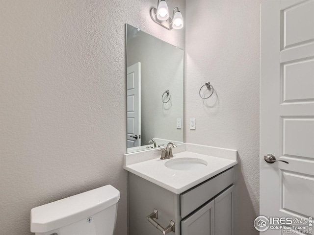 13 Chipeta Way, Lochbuie, CO 80603 - bathroom featuring a textured wall and vanity