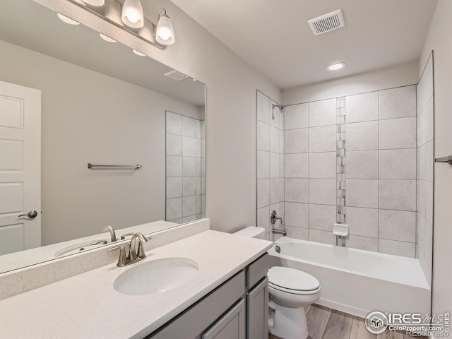 13 Chipeta Way, Lochbuie, CO 80603 - full bath with vanity, wood finished floors, shower / bathtub combination, and recessed lighting