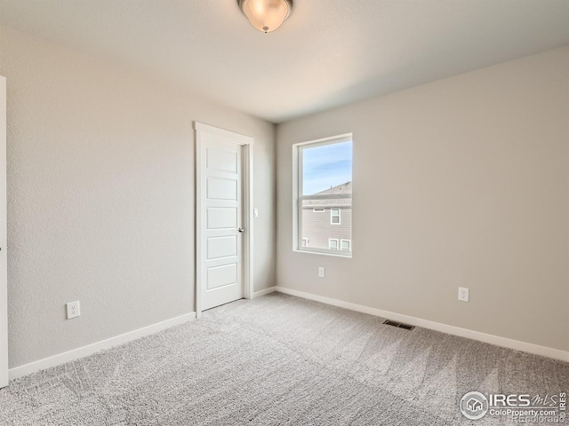 13 Chipeta Way, Lochbuie, CO 80603 - carpeted empty room featuring baseboards