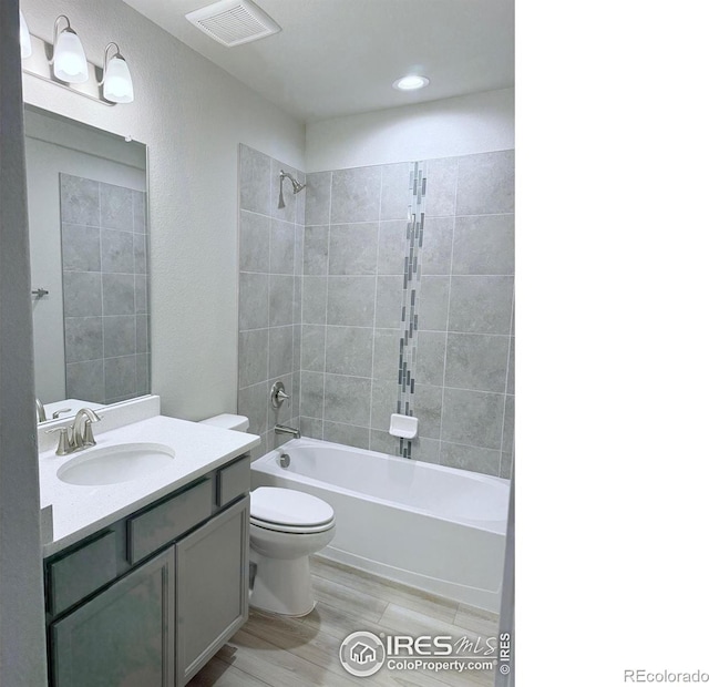 13 Chipeta Way, Lochbuie, CO 80603 - full bath with vanity, shower / bath combination, and wood finished floors