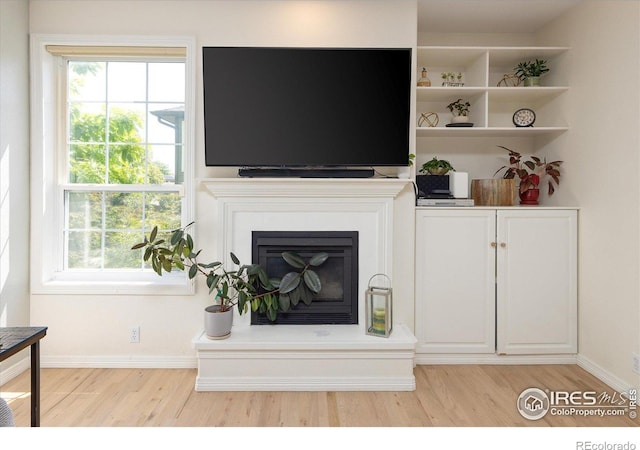 691 Tamarisk Ct, Louisville, CO 80027 - living room with light wood-style floors and plenty of natural light