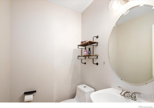 691 Tamarisk Ct, Louisville, CO 80027 - half bathroom featuring a sink and toilet