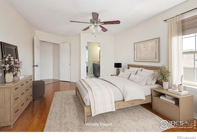 691 Tamarisk Ct, Louisville, CO 80027 - bedroom featuring wood finished floors, ensuite bath, and ceiling fan