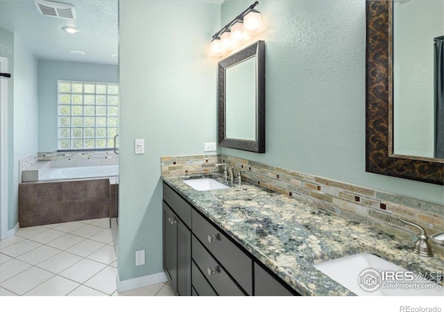 691 Tamarisk Ct, Louisville, CO 80027 - full bathroom featuring a bath, double vanity, tasteful backsplash, and tile patterned floors