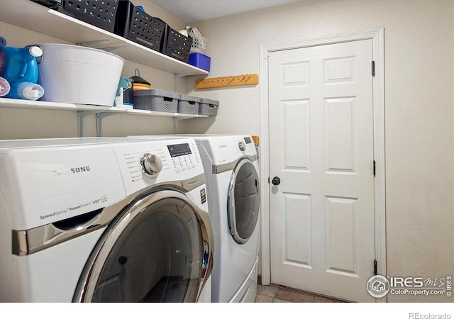 691 Tamarisk Ct, Louisville, CO 80027 - laundry area with separate washer and dryer and tile patterned floors