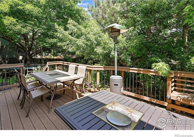 691 Tamarisk Ct, Louisville, CO 80027 - wooden deck with outdoor dining space