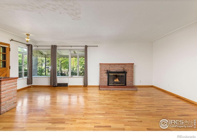 2940 9th St, Boulder, CO 80304 - unfurnished living room with light wood-type flooring and a glass covered fireplace