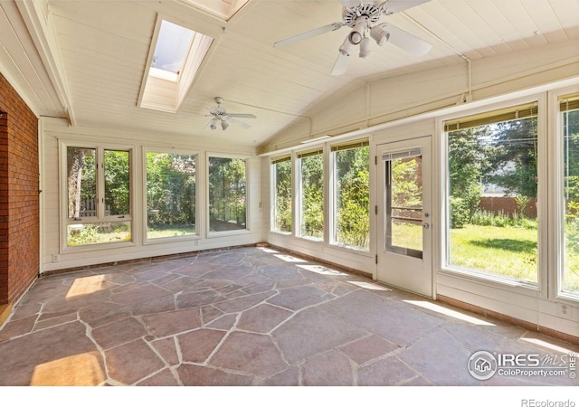 2940 9th St, Boulder, CO 80304 - unfurnished sunroom featuring stone flooring, a skylight, vaulted ceiling, wood ceiling, and brick wall