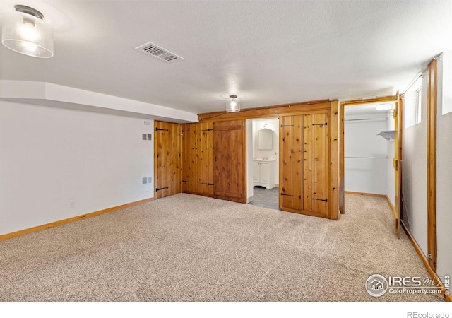 2940 9th St, Boulder, CO 80304 - unfurnished bedroom with light colored carpet, a walk in closet, ensuite bathroom, and a closet