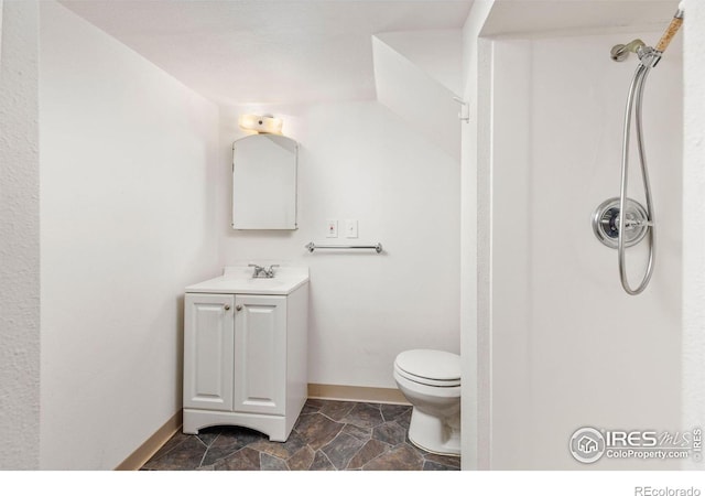 2940 9th St, Boulder, CO 80304 - full bathroom featuring vanity, stone finish floors, and a shower