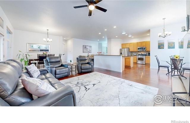 555 S 17th Ave, Brighton, CO 80601 - living room featuring a chandelier, wood finished floors, recessed lighting, and ceiling fan