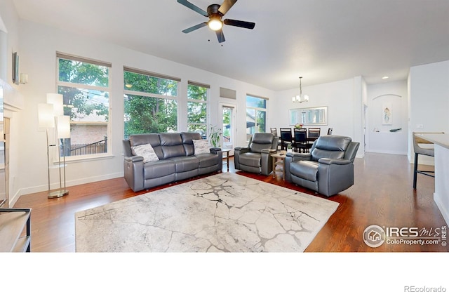 555 S 17th Ave, Brighton, CO 80601 - living room with wood finished floors, a chandelier, and ceiling fan