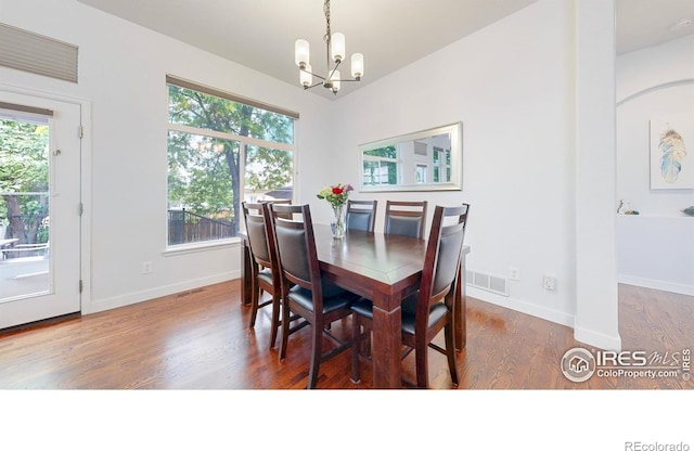 555 S 17th Ave, Brighton, CO 80601 - dining space featuring a chandelier and wood finished floors