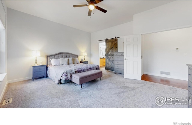555 S 17th Ave, Brighton, CO 80601 - bedroom featuring a barn door, carpet floors, a ceiling fan, and ensuite bath