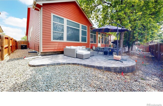 555 S 17th Ave, Brighton, CO 80601 - fenced backyard featuring an outdoor hangout area and a patio