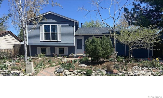 1430 Kennedy Ave, Louisville, CO 80027 - split level home with a chimney