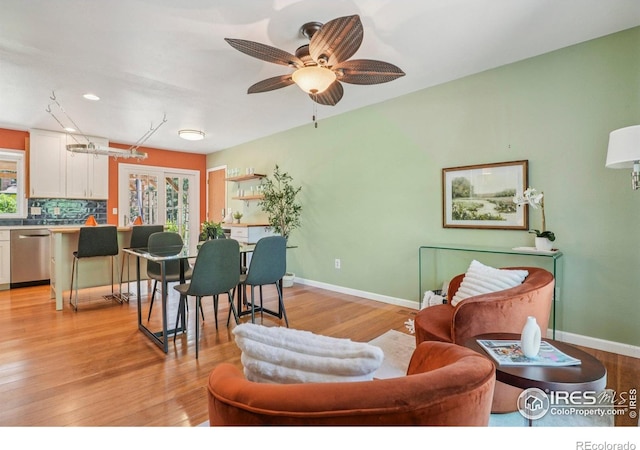 1430 Kennedy Ave, Louisville, CO 80027 - living area featuring light wood-style floors and ceiling fan