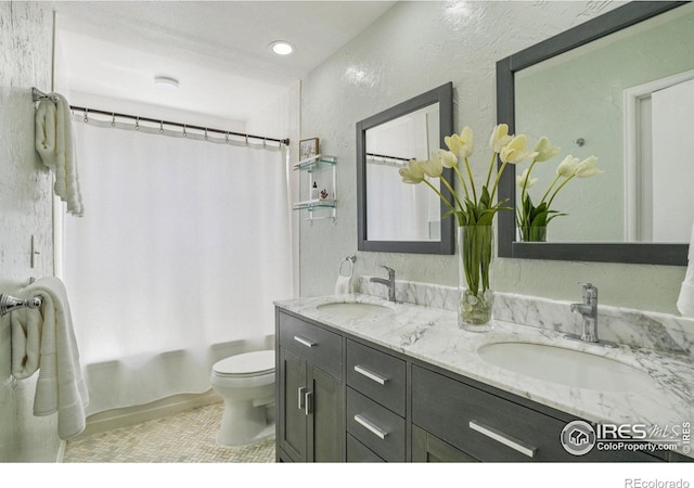 1430 Kennedy Ave, Louisville, CO 80027 - full bathroom with double vanity, tile patterned flooring, shower / tub combo with curtain, and recessed lighting