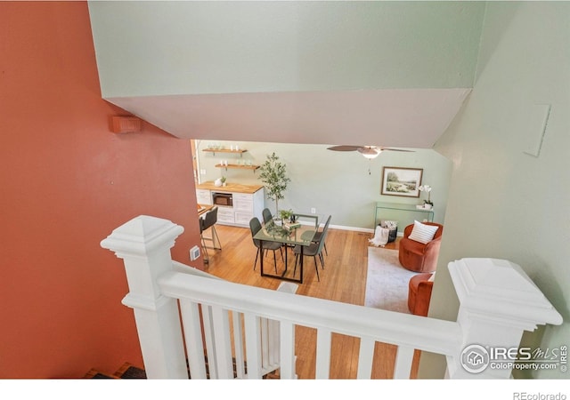 1430 Kennedy Ave, Louisville, CO 80027 - staircase featuring a ceiling fan, wood finished floors, and vaulted ceiling
