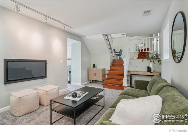1430 Kennedy Ave, Louisville, CO 80027 - carpeted living area with stairs, track lighting, and vaulted ceiling