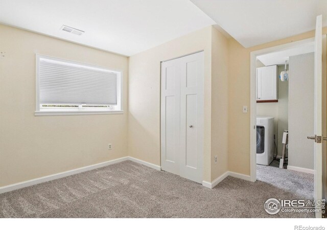 1430 Kennedy Ave, Louisville, CO 80027 - unfurnished bedroom with washer / dryer, carpet, and a closet