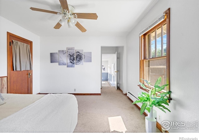 612 20th St, Greeley, CO 80631 - bedroom with carpet, a baseboard radiator, and a ceiling fan