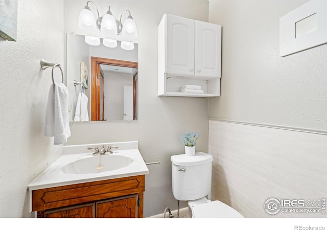 612 20th St, Greeley, CO 80631 - half bathroom featuring vanity and toilet