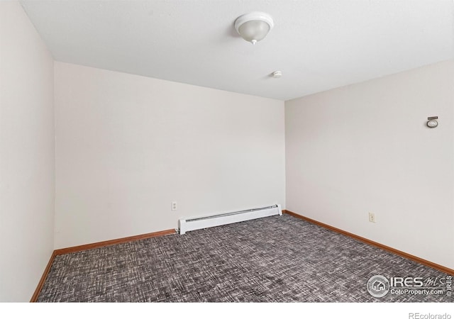 612 20th St, Greeley, CO 80631 - carpeted spare room with baseboard heating and baseboards