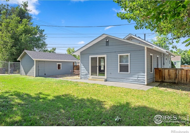 612 20th St, Greeley, CO 80631 - rear view of house featuring a fenced backyard and an outbuilding