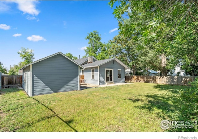 612 20th St, Greeley, CO 80631 - rear view of property with a fenced backyard and an outdoor structure