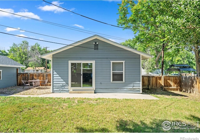 612 20th St, Greeley, CO 80631 - back of property with a fenced backyard and a patio