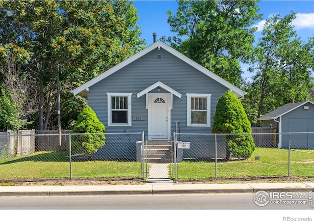 612 20th St, Greeley, CO 80631 - bungalow-style home with a fenced front yard and a gate