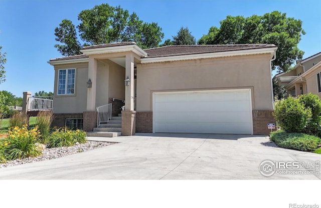 7294 Tamarisk Dr, Fort Collins, CO 80528 - ranch-style house featuring brick siding, driveway, an attached garage, and stucco siding