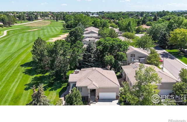 7294 Tamarisk Dr, Fort Collins, CO 80528 - drone / aerial view of a golf course and a tree filled landscape