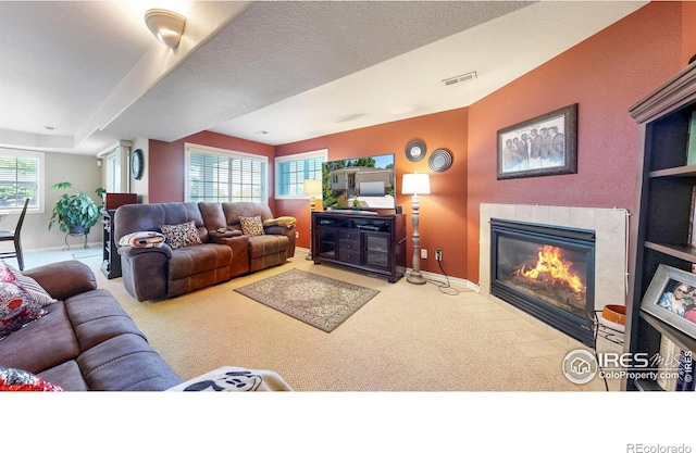 7294 Tamarisk Dr, Fort Collins, CO 80528 - living room with a tiled fireplace and carpet floors