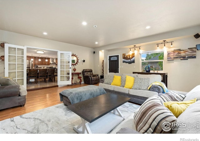 144 Placer Ave, Longmont, CO 80504 - living area featuring wood finished floors, french doors, and recessed lighting