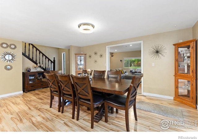 144 Placer Ave, Longmont, CO 80504 - dining room featuring light wood finished floors and stairway