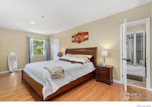 144 Placer Ave, Longmont, CO 80504 - bedroom with wood finished floors and ensuite bathroom
