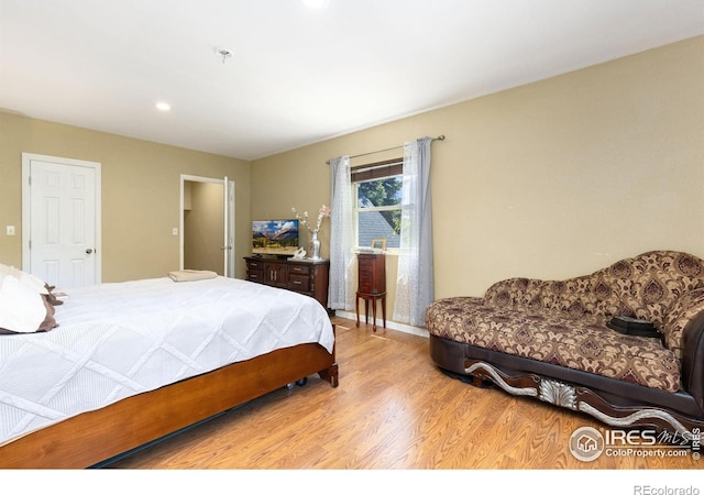144 Placer Ave, Longmont, CO 80504 - bedroom with wood finished floors and recessed lighting