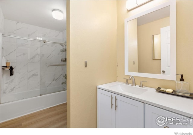 144 Placer Ave, Longmont, CO 80504 - bathroom with wood finished floors, vanity, and  shower combination