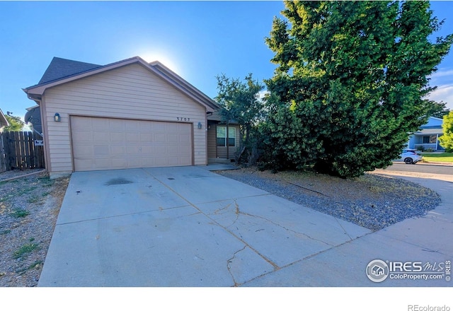 3705 Dove Ln, Evans, CO 80620 - ranch-style house featuring driveway and an attached garage