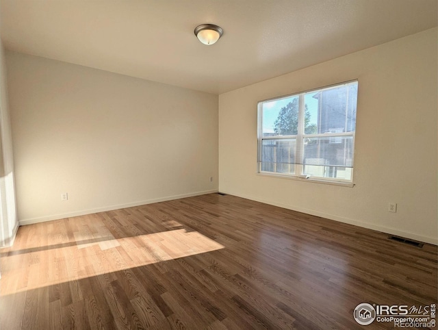3705 Dove Ln, Evans, CO 80620 - empty room featuring wood finished floors and baseboards