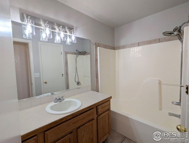 3705 Dove Ln, Evans, CO 80620 - bathroom featuring bathing tub / shower combination, vanity, and tile patterned flooring