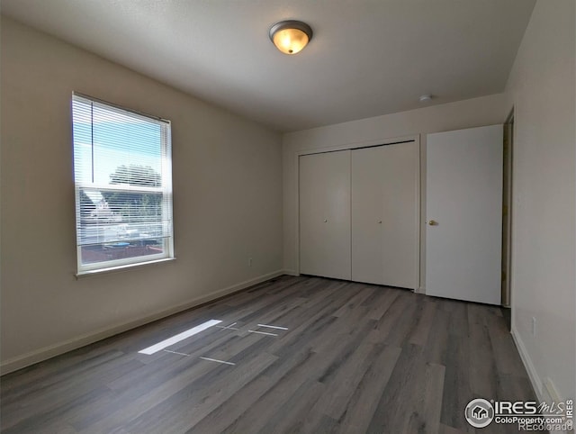 3705 Dove Ln, Evans, CO 80620 - unfurnished bedroom with wood finished floors and a closet