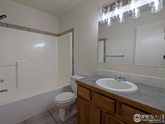 3705 Dove Ln, Evans, CO 80620 - bathroom featuring vanity, shower / bathtub combination, and tile patterned flooring