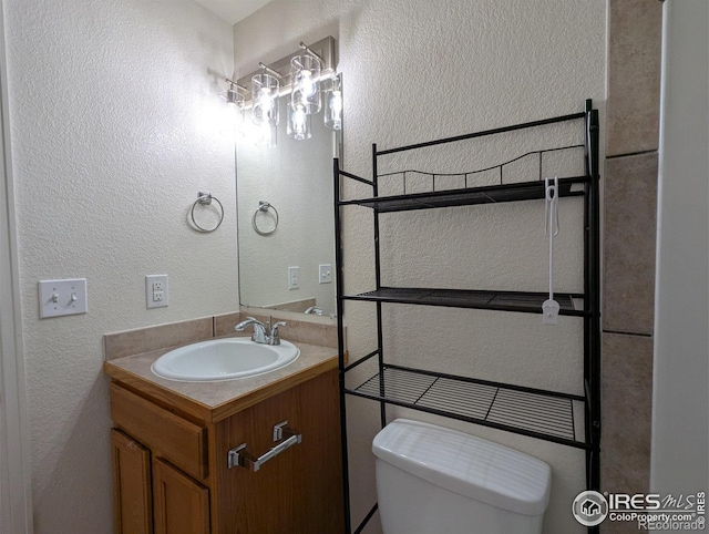 3705 Dove Ln, Evans, CO 80620 - bathroom with a textured wall and vanity
